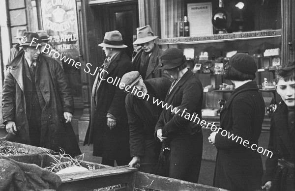 STREET SCENE WITH MARKET ?